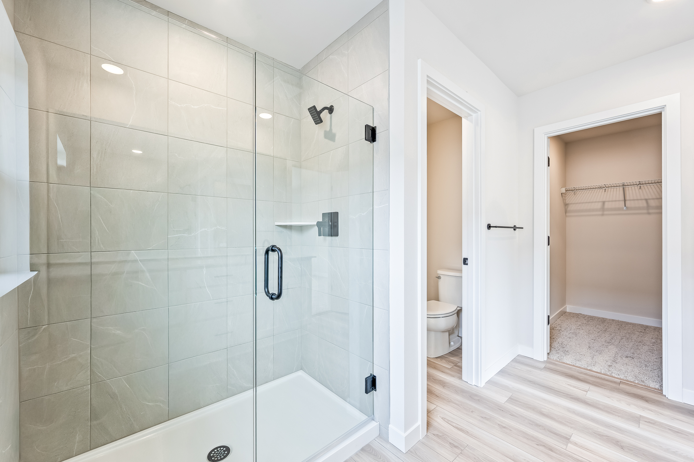 A bathroom with a glass shower.