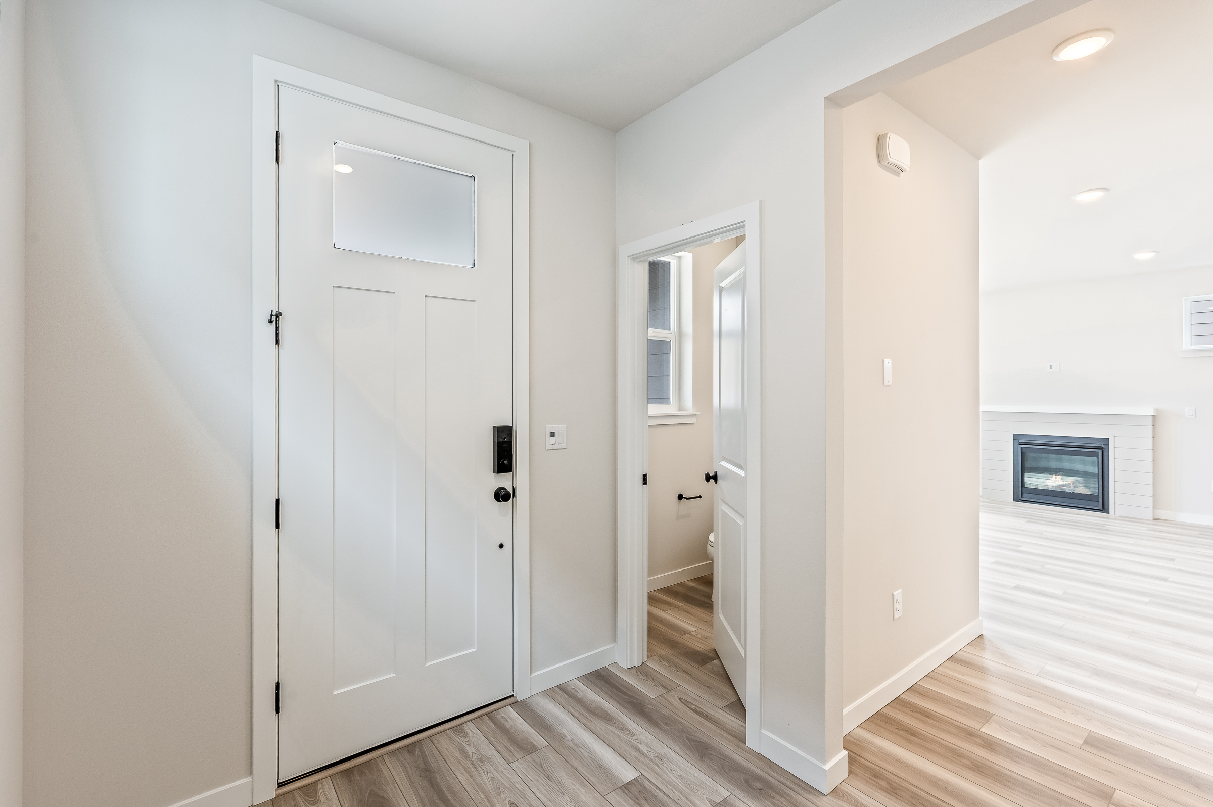 A hallway with white doors.
