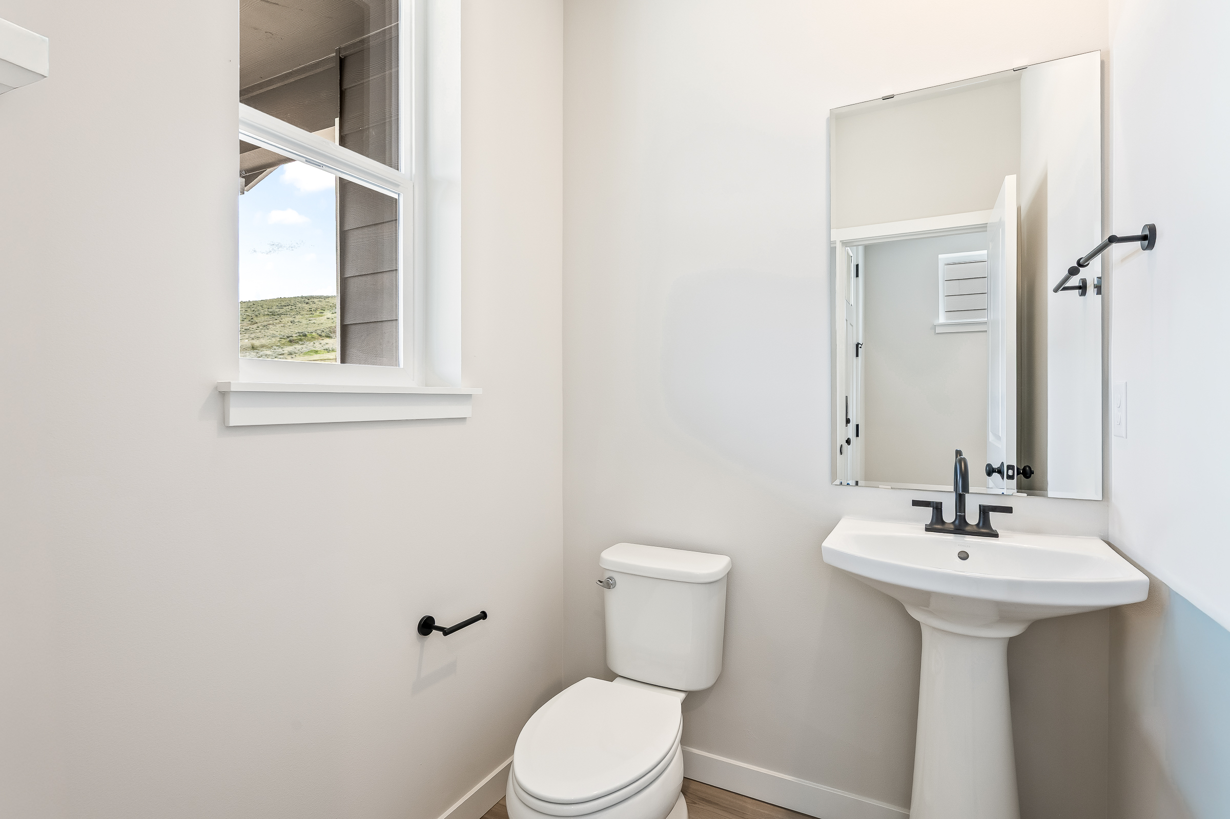 A bathroom with a toilet and sink.