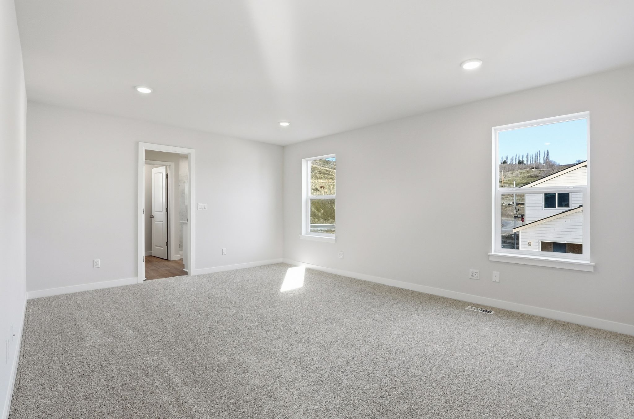 A room with a large window.