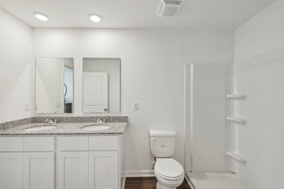 A bathroom with a marble countertop.