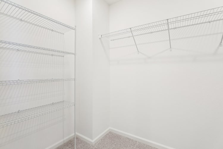 A white room with a metal railing.