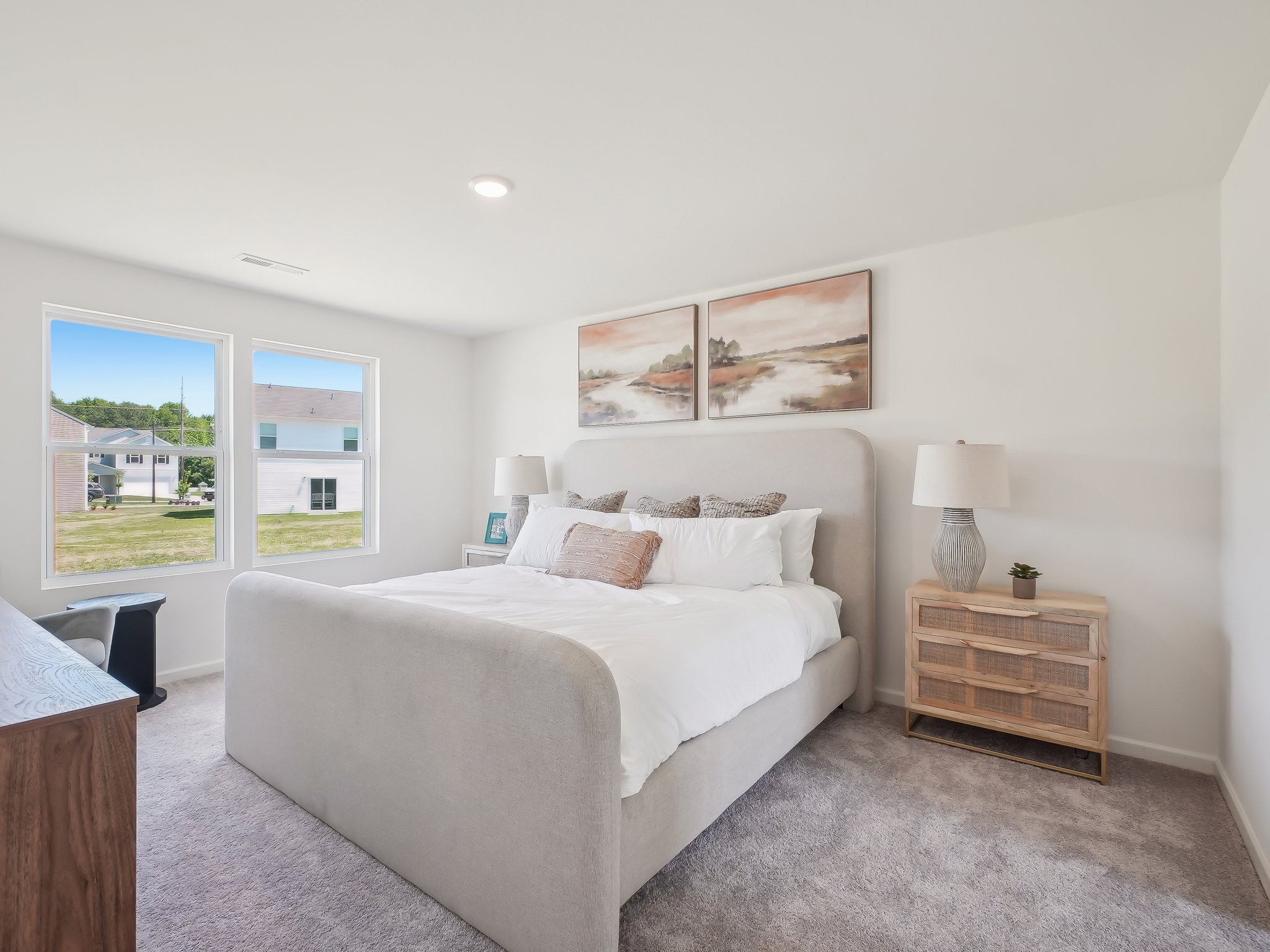 A bedroom with a large bed.