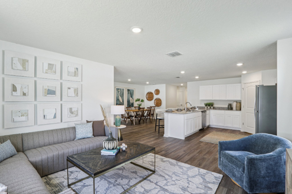 A living room with a couch and a table.