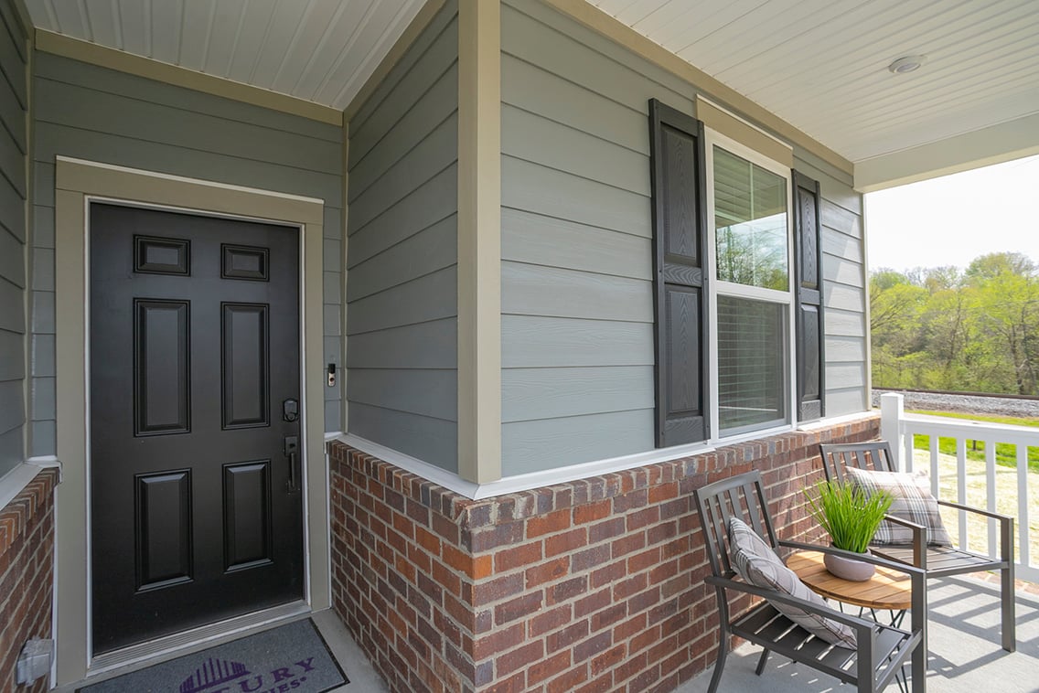 A patio with a table and chairs.