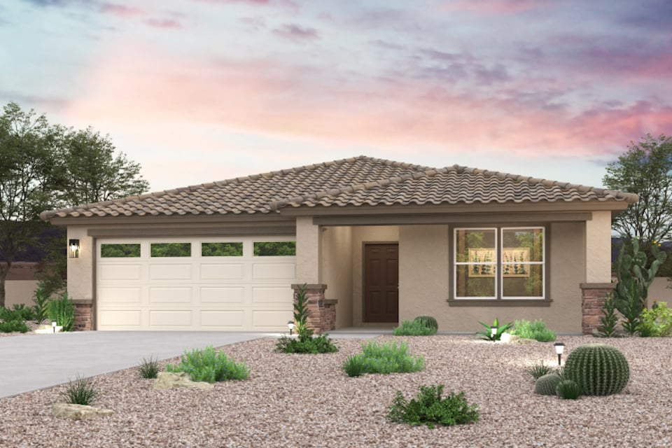 A house with a gravel driveway.