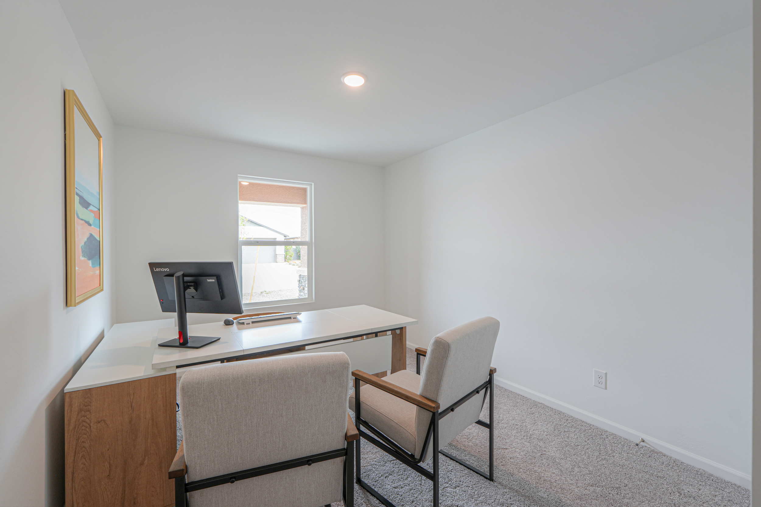 A room with a table and chairs.