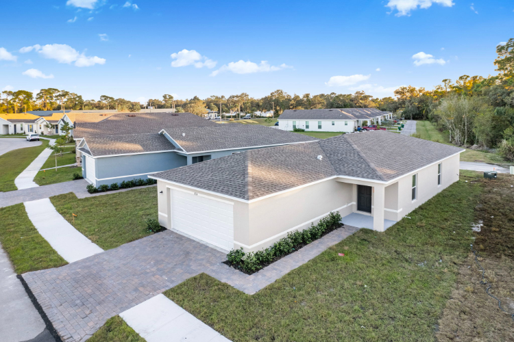 A house with a grass yard.