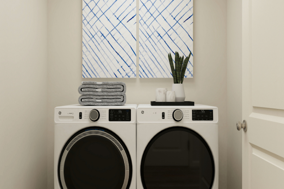 A washing machine in a room.