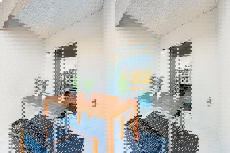 A table and chairs in a room.