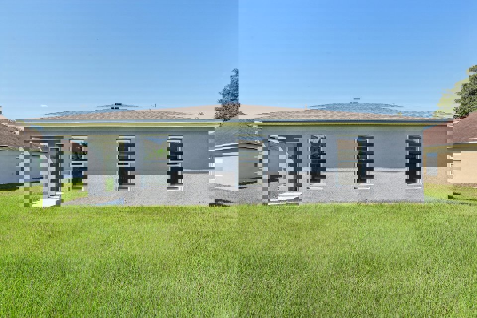 A house with a grass yard.