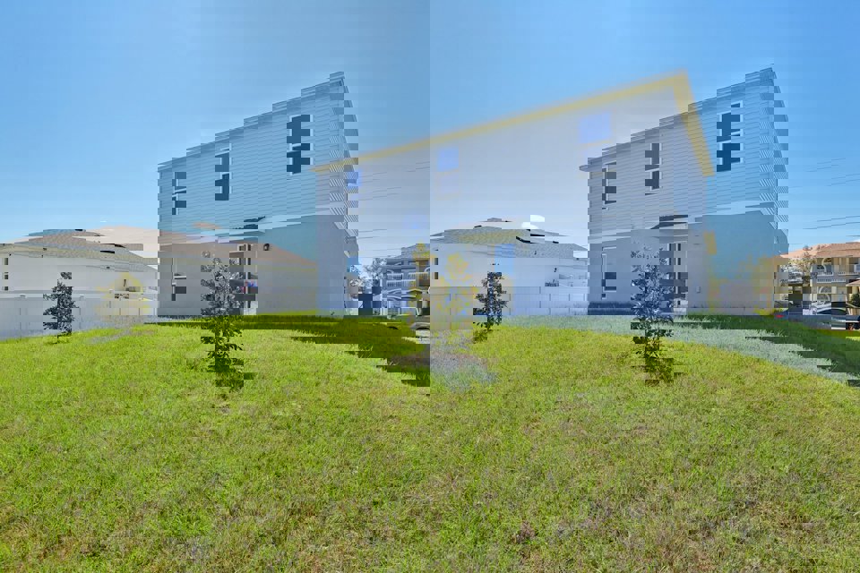 A house with a lawn in front of it.