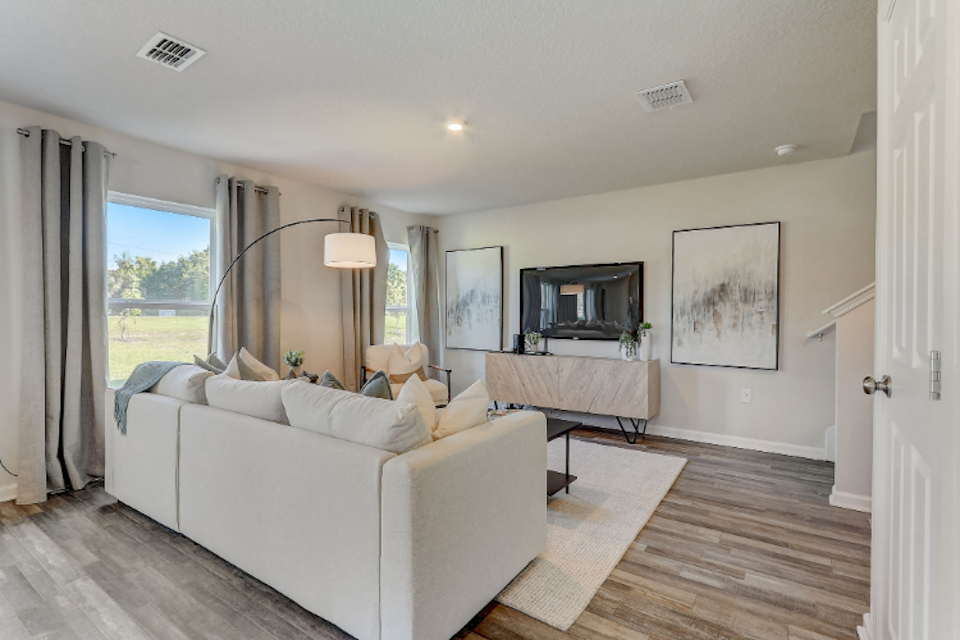 A living room with a large window.