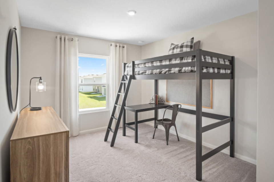 A room with a table and a chair.