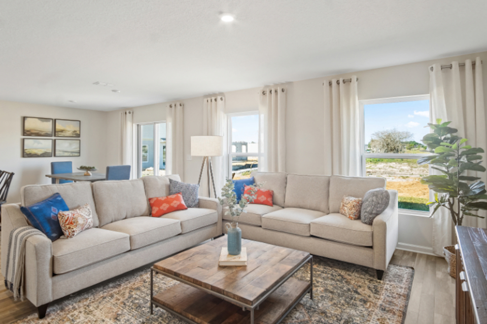A living room with a couch and a coffee table.