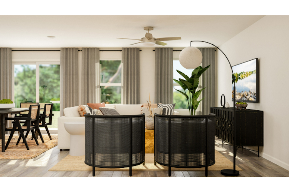 A living room with a couch and chairs.