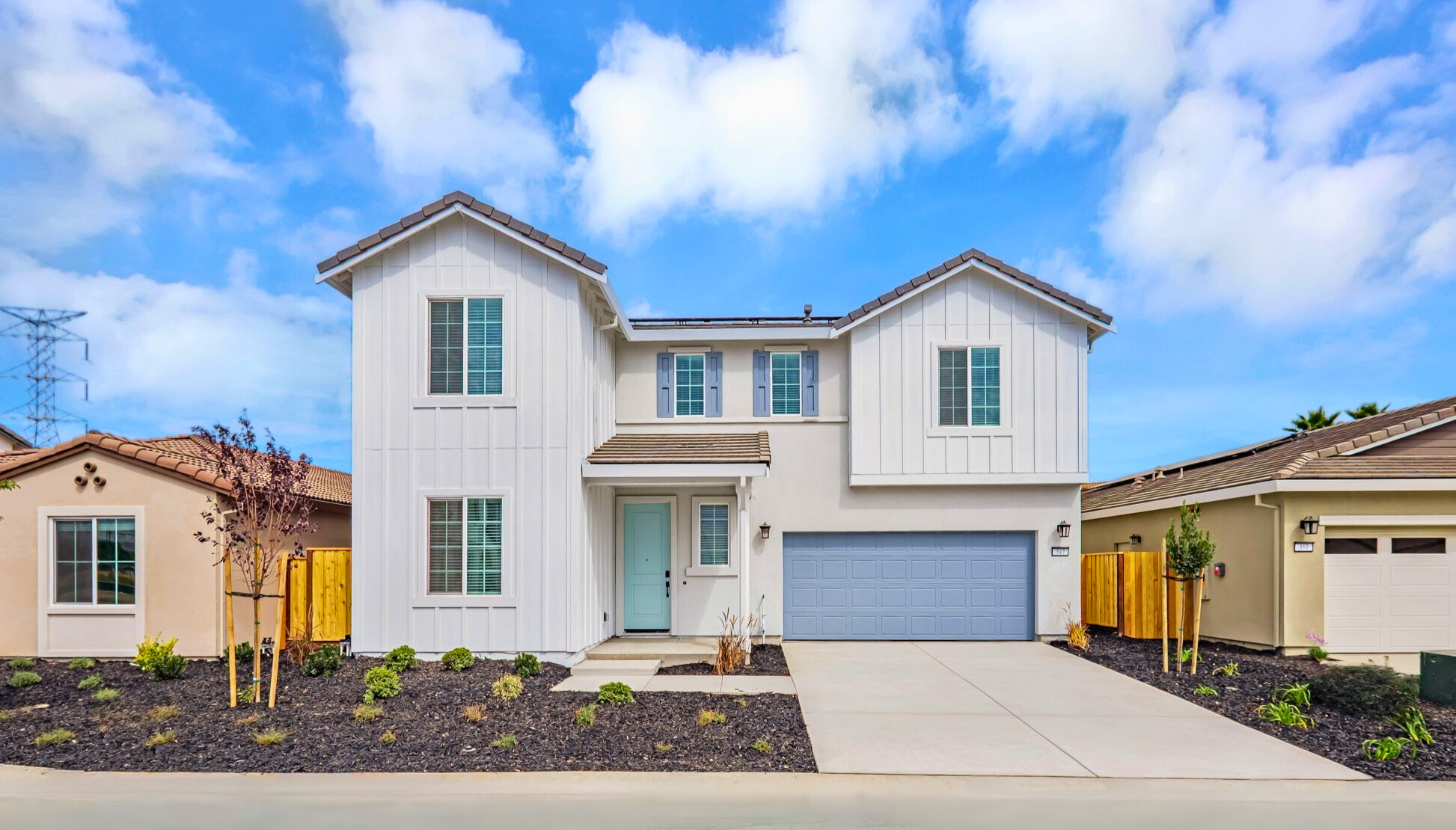 A white house with a driveway.